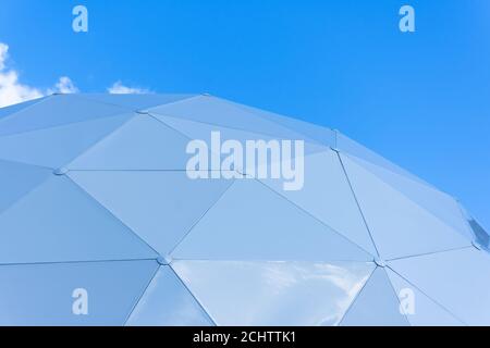 Dome consisting of triangular pieces of shelter section on the sky background Stock Photo