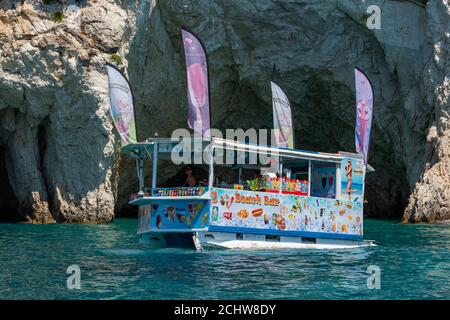 a floating ice cream van or kiosk at the caves in kiri turtle island on the greek island of zakynthos, greece Stock Photo