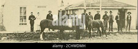 . S.D. Butcher's pioneer history of Custer County : and short sketches of early days in Nebraska . AND SHORT SKI^TCHES OF EARLY DAYS IN NEBRASKA. 109 TJ^ 10 !&gt;. oA- 0  Old Marble Top Hotel in 1886, with Dr. Hull and his favorite Ponies in front. Location nowoccupied by the Realty Block. in town he would turn over all his practice to hinu The inducement was snffi-cient, and Dr. Hull at once secured a sod house that J. P. Gandv had built andmoved his family to Iroken Bow. The doctor did not prov(^ a drawinji; cardas a physician, and soon titted up rooms in his house and eniiJiged in thehoi e Stock Photo