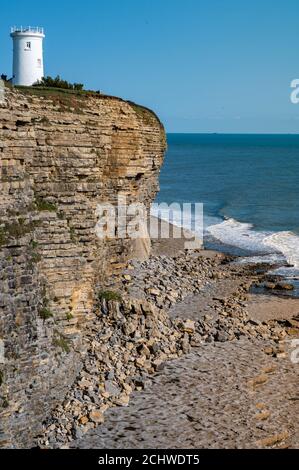 Nash Point Lighthouse, Vale of Glamorgan, cliff edge view over looking sea Stock Photo