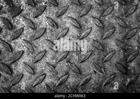 Old diamond plate pattern, metal flooring texture. Background black and white photo texture Stock Photo