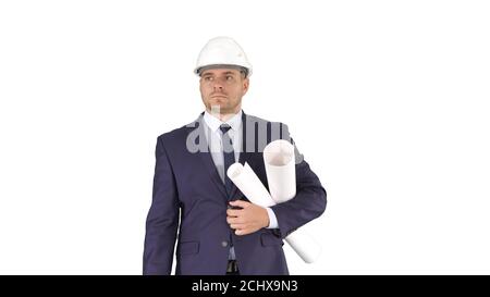Male architect in a suit and hard hat walking with blueprints and briefcase on white background. Stock Photo