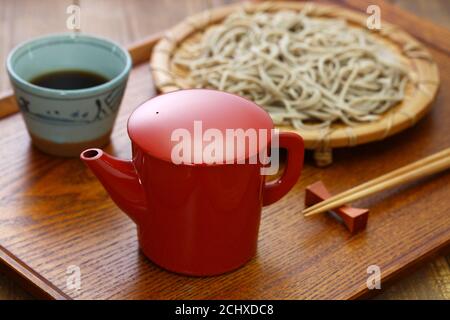 Sobayu is the hot water from boiling noodles in buckwheat noodle restaurants. After the soba(buckwheat) noodles are eaten, many people enjoy drinking. Stock Photo