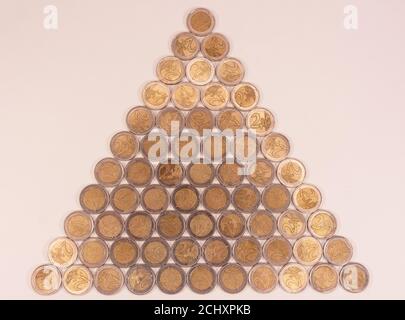 Pyramid Pattern Coins Pyramid representation of a 1 euro coin Stock Photo - Alamy
