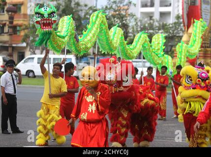 Men perform a dragon and lion dance ahead of the Chinese Lunar New Year in Phnom Penh, Cambodia, January 26, 2017. REUTERS/Samrang Pring