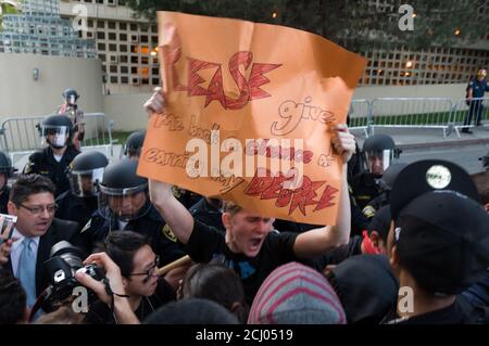 Los Angeles, CA, USA. 20th Nov, 2009. Students and police officers face off during a protest against a 32 percent tuition increase at the University of California Los Angeles. Stock Photo