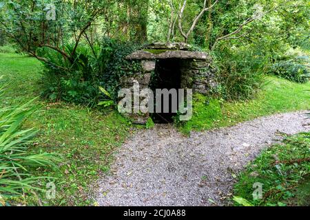 An old stone structure housing an old water well. Stock Photo