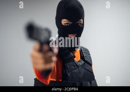 gangster girl with gun and mask