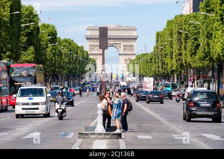 The Avenue des Champs Elysees on a beautiful summer day in Paris Stock Photo