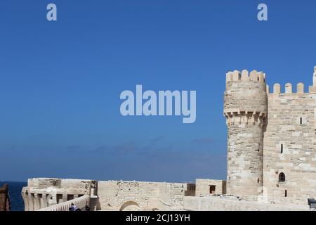 Front view of The Citadel of Qaitbay Qaitbay Fort, Is a 15th century defensive fortress located on the Mediterranean sea coast. Castle, port Stock Photo