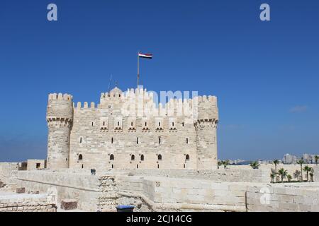 Front view of The Citadel of Qaitbay Qaitbay Fort, Is a 15th century defensive fortress located on the Mediterranean sea coast. Castle, port Stock Photo