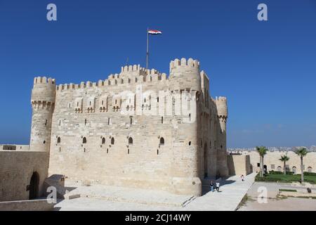 Front view of The Citadel of Qaitbay Qaitbay Fort, Is a 15th century defensive fortress located on the Mediterranean sea coast. Castle, port Stock Photo