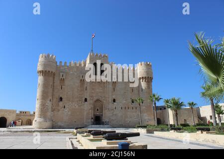 Front view of The Citadel of Qaitbay Qaitbay Fort, Is a 15th century defensive fortress located on the Mediterranean sea coast. Castle, port Stock Photo