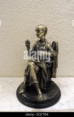 old man figure sewing Stock Photo