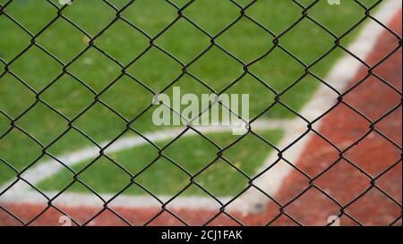 Astroturf corner surrounded by iron wires Stock Photo