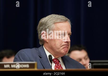 U.S. Rep. Mark Meadows (R-NC) reacts while listening to fellow Representative Rashida Tlaib (D-MI) speak during the testimony of Michael Cohen, the former personal attorney of U.S. President Donald Trump, at a House Committee on Oversight and Reform hearing on Capitol Hill in Washington, U.S., February 27, 2019. REUTERS/Joshua Roberts