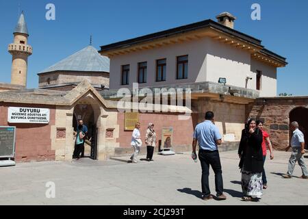 HACI BEKTAS, TURKEY - AUGUST 25: Old woman visiting at famous mosque of Haci  Bektas Veli and behind writes the rules of humanity on August 25, 2013 in  Nevsehir, Turkey Stock Photo - Alamy