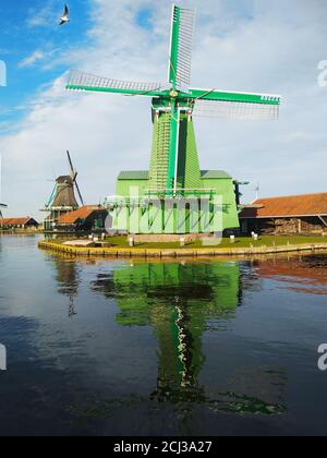 beautiful panorama of Zaanse Scans in the Netherlands. Windmills on ponds and streams Stock Photo