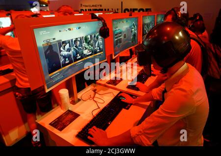 A cosplayer wears a self-made helmet of a character from the computer game  PlayerUnknown's Battlegrounds,