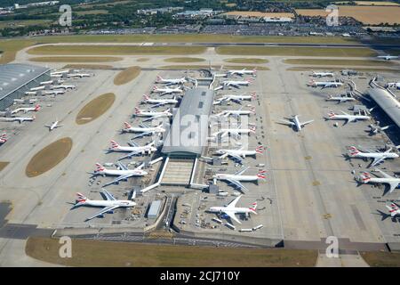 London Heathrow Airport British Airways Terminal 5 satellite 5B aerial view. Multiple aircraft at busy airport terminal in United Kingdom. Stock Photo