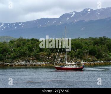 Tourist Boat moored in untouched nature at Lago Roca, Tierra del Fuego National Park, Argentina, South America Stock Photo