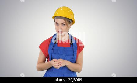Construction female worket explaining her ideas to camera on gra Stock Photo