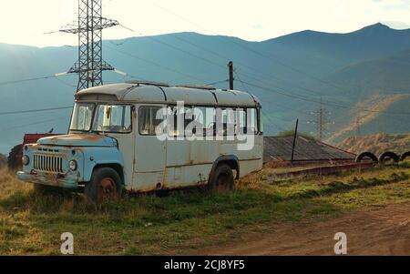 Old Soviet style bus in the countryside of Armenia Stock Photo