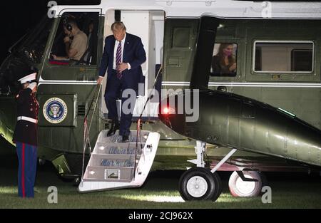 Washington, United States. 15th Sep, 2020. President Donald Trump walks off Marine One as Hope Hicks is seen through the window as he returns to the White House following a trip to the west coast, on September 14, 2020 in Washington, DC. Photo by Kevin Dietsch/UPI Credit: UPI/Alamy Live News Stock Photo