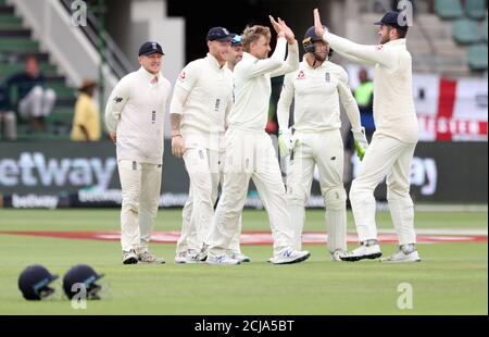 Cricket - South Africa v England - Third Test - St George's Park, Port Elizabeth, South Africa - January 19, 2020   England's Joe Root celebrates taking the wicket of South Africa's Pieter Malan with teammates    REUTERS/Siphiwe Sibeko