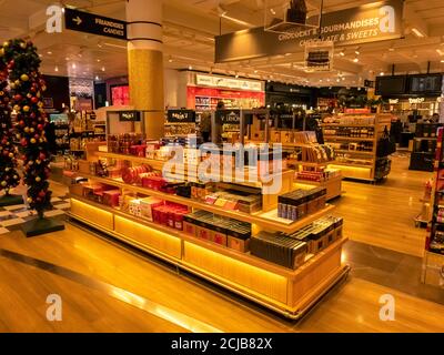 Paris, France - september 18, 2020 . Maxim's products on sale in duty free shop at Paris airport, France. Famous brand of food, french landmark Stock Photo