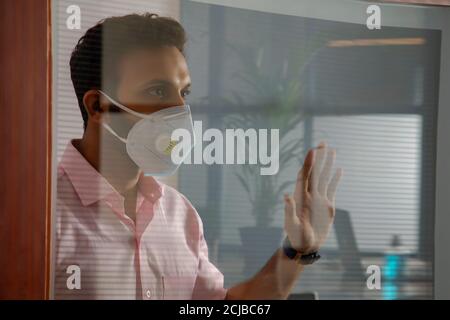 Young man staying at home during a pandemic Stock Photo