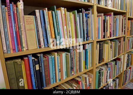 A bookshelf full of secondhand books on crafts in a Leominster Antiques Centre Stock Photo