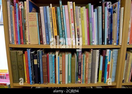 A bookshelf full of secondhand books on crafts in a Leominster Antiques Centre Stock Photo