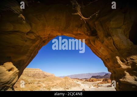 The Arch, Timna Valley, Arava, Israel. The Timna Natural and Historic park is located in the southwestern Arava, some 30 km. north of the Gulf of Eila Stock Photo