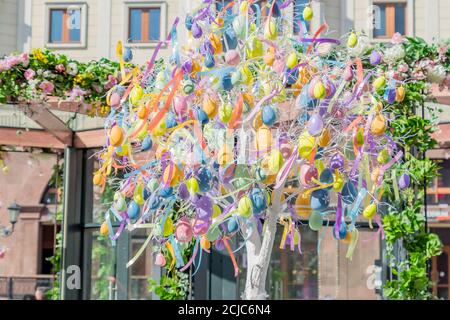 colorfull easter egg tree. brights eggs hanging from branches. Stock Photo