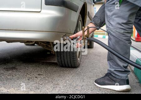 Cars being charged at LPG gas stations / LPG gas filling stations and cars. Stock Photo