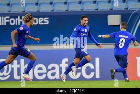 Doha, Capital of Qatar. 14th Sep, 2020. Hattan Bahebri (C) of AL Hilal celebrates after scoring during the AFC Asian Champions League group B football match between AL Hilal of Saudi Arabia and Pakhtakor of Uzbekistan at Al Janoub Stadium in Doha, Capital of Qatar, Sept. 14, 2020. AL Hilal won 2-1. Credit: Nikku/Xinhua/Alamy Live News Stock Photo