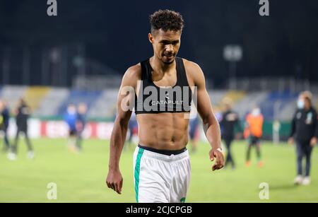 Jena, Germany. 12th Sep, 2020. Football: DFB Cup, FC Carl Zeiss Jena - Werder Bremen, 1st round. Werder's player Theodor Gebre Selassie leaves the field after the match. Credit: Jan Woitas/dpa-Zentralbild/dpa - IMPORTANT NOTE: In accordance with the regulations of the DFL Deutsche Fußball Liga and the DFB Deutscher Fußball-Bund, it is prohibited to exploit or have exploited in the stadium and/or from the game taken photographs in the form of sequence images and/or video-like photo series./dpa/Alamy Live News Stock Photo