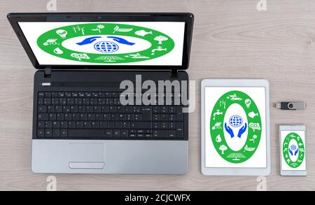 Environment protection concept shown on different information technology devices Stock Photo