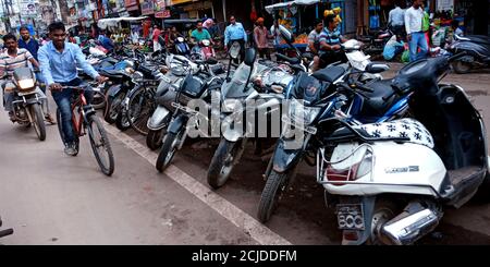 DISTRICT KATNI, INDIA - SEPTEMBER 24, 2019: Motorbikes parked on road side without parking space. Stock Photo