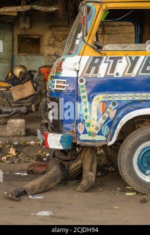 A mechanic working on a truck in Marché Sandaga, Plateau, Dakar, Senegal Stock Photo