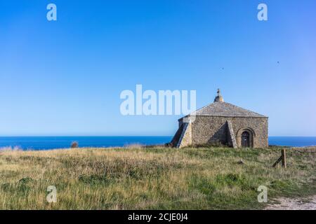 St. Aldhelm’s Chapel - a small 12th century church at St. Aldhelm’s Head near Swanage on the Jurassic Coast, Dorset, England, UK Stock Photo