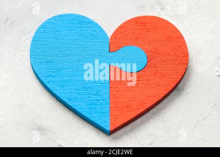 Heart puzzle The two halves of the heart of a man and a woman joined together. Two parts of love. Couple of lovers Stock Photo