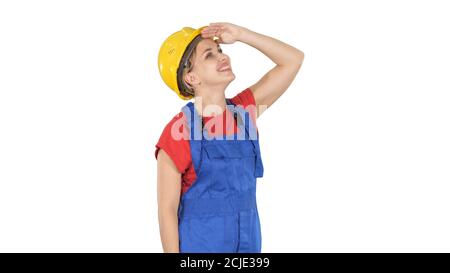 Engineer construction worker woman looking up at something amazi Stock Photo