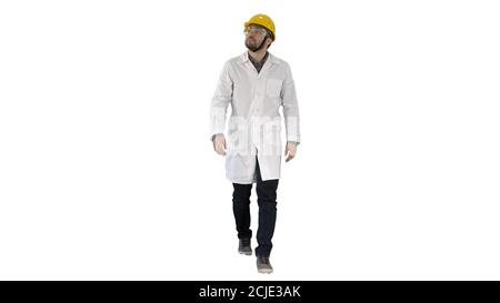 Engineer putting on protactive glasses while walking on white ba Stock Photo