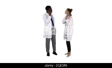 Female and male doctor using mobile phones making calls telling Stock Photo