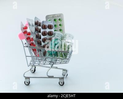 medicines in a shopping cart. The concept of buying medicines on the Internet, online, on the site, remotely Stock Photo