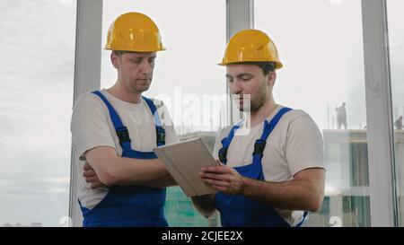 Construction specialist using a tablet computer. Stock Photo