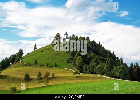 St. Jacob church on top of the hill in the summer, Sv. Jakob - Slovenia. Religion, hiking and nature concepts Stock Photo