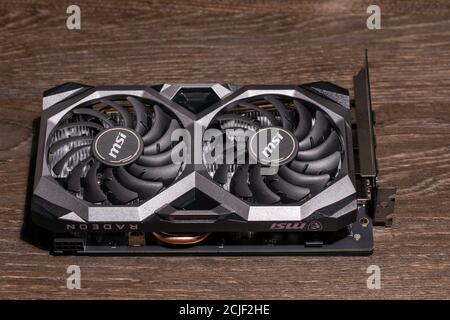 Video graphics card electronic device or computer part on wooden table. Russia, 08.02.2020 Stock Photo
